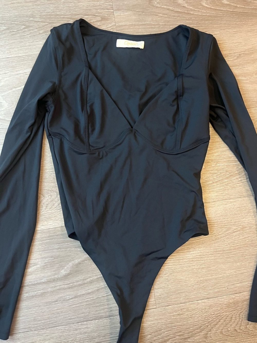 Qinsen black bodysuit with long sleeves